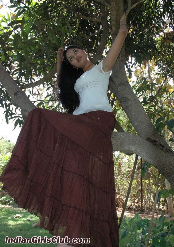 tamil girl sitting on tree branch