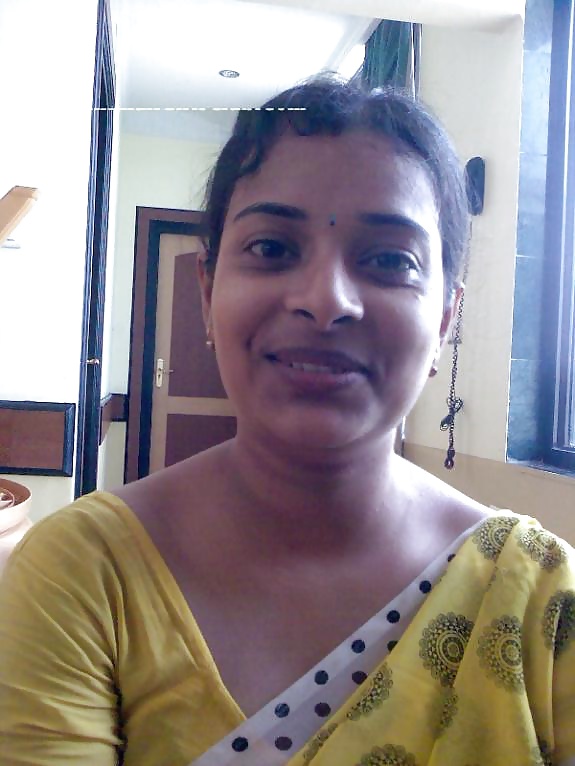 Hot Indian Aunty In Yellow Sari